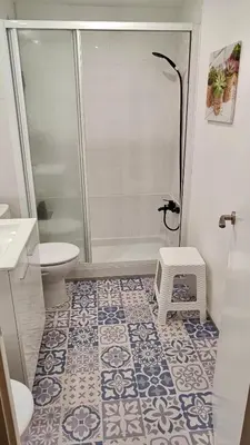 a bathroom with a shower and a toilet at Canet playa y centro con free wifi in Canet de Mar