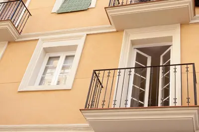 a building with a balcony and a window at Enjoy Apartments VP Camp Nou 2 in Barcelona