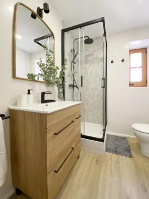 a bathroom with a sink and a shower at Historic House at Can Quintana by Casa de Elena in Pineda de Mar