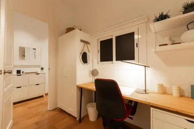 a home office with a desk and a chair at Eixample Apartment in Barcelona