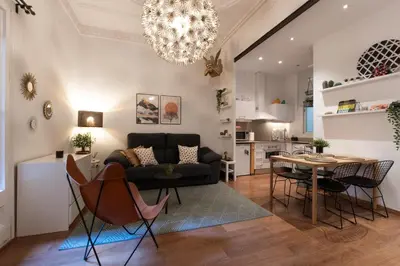 a living room with a couch and a table at Eixample Apartment in Barcelona