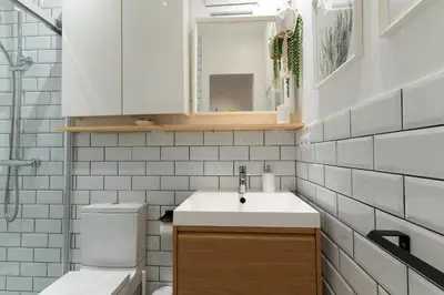 a bathroom with a sink and a toilet at Eixample Apartment in Barcelona