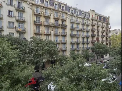 a large building in front of a building at Paseo San Juan Barcelona in Barcelona