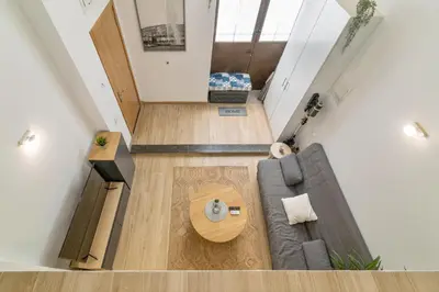 an overhead view of a living room with a couch and a table at Nice Central Loft in Vilanova i la Geltrú