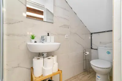 a bathroom with a sink and a toilet at Nice Central Loft in Vilanova i la Geltrú