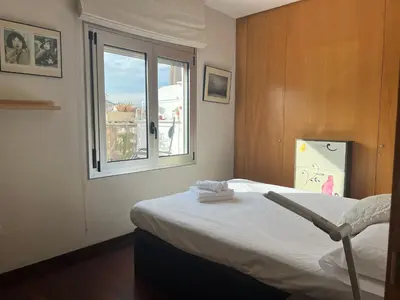 a bedroom with a bed and a window at Sagrada Familia in Barcelona
