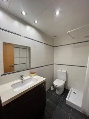 a bathroom with a sink and a toilet and a mirror at CASA NEUS, Casa única cerca de Barcelona in Sant Feliu de Llobregat
