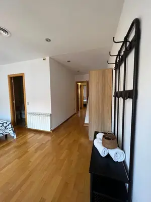 a room with a bed and a wooden floor at CASA NEUS, Casa única cerca de Barcelona in Sant Feliu de Llobregat