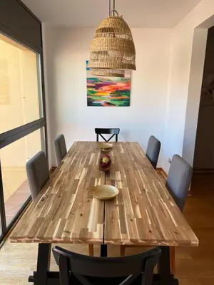 a large wooden table with chairs in a room at CASA NEUS, Casa única cerca de Barcelona in Sant Feliu de Llobregat
