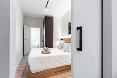 a bedroom with a bed with teddy bears on it at Exclusive Apartments Barcelona 4 personas St Pere in Terrassa