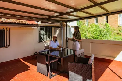 a man and a woman standing on a patio at Leevin Student Barcelona in Barcelona