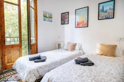 two beds sitting next to each other in a room at Centric Apartments Sagrada Famila 3 in Barcelona