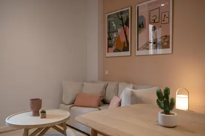 a living room with a couch and a table at CATERINA Sant Pau in Barcelona