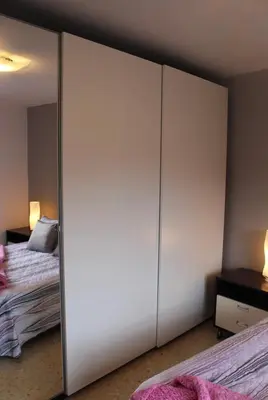 a bedroom with a sliding closet door with a bed at Barcelo al riu in Monistrol