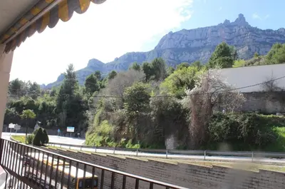 a view of a road with mountains in the background at Barcelo al riu in Monistrol