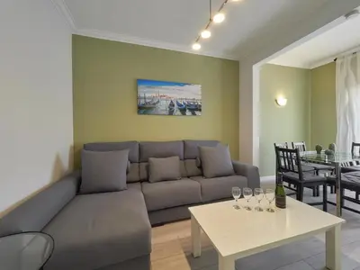 a living room with a couch and a table at Sagrada Familia Penthouse in Barcelona