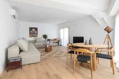 a living room with a couch and a table at Luxury apartment in Barcelona City Center in Barcelona