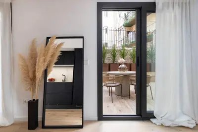 a door leading to a dining room with a table at Luxury apartment in Barcelona City Center in Barcelona
