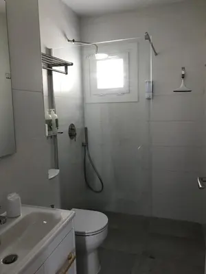a bathroom with a shower and a toilet and a sink at Campagne luxueuse de Sitges in Olivella