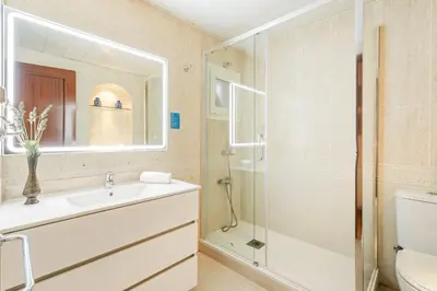 a bathroom with a sink and a shower at AB Paralel Blai Apartment in Barcelona