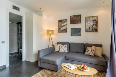 a living room with a couch and a table at 1802 - AB Poblenou Comfort in Barcelona