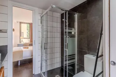 a bathroom with a shower with a toilet and a sink at 1802 - AB Poblenou Comfort in Barcelona