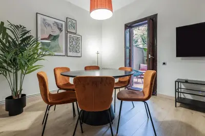 a dining room with a table and chairs at Stay U-nique Apartment Gran Via IV in Barcelona