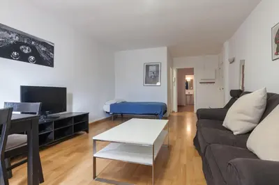 a living room with a couch and a table at Rambla Suites in Barcelona