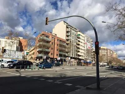 a traffic light on a city street with buildings at New & Sunny Apartment in Barcelona