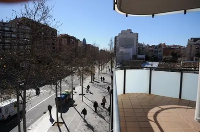 a group of people walking on a city street at New & Sunny Apartment in Barcelona