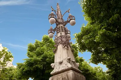 a street light on top of a stone pillar at LetsGo Sagrada Familia Penthouse in Barcelona