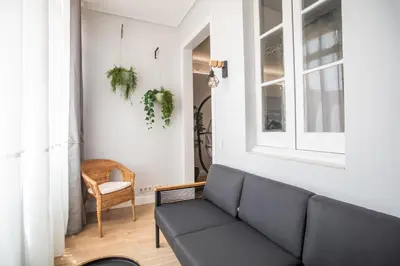 a living room with a couch and a chair at Tendency Apartments Miro 6 in Barcelona