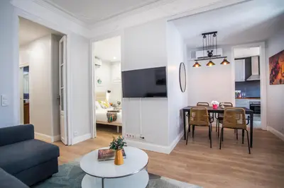 a living room with a table and a dining room at Tendency Apartments Miro 6 in Barcelona