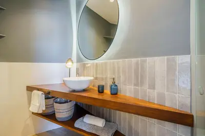 a bathroom with a sink and a mirror at Sitges Spaces Mediterranean Penthouse in Sitges