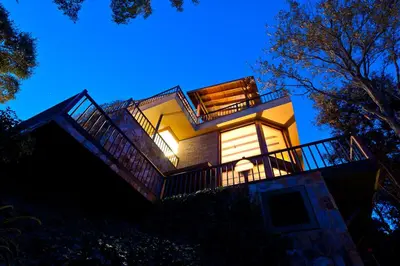 a house on a hill at night at Fantástica casa con vistas al mar in Arenys de Munt