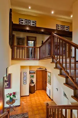 a large hallway with a staircase in a house at Fantástica casa con vistas al mar in Arenys de Munt