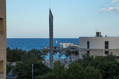 a view of the ocean from a building at Alcam Vila Olímpica in Barcelona