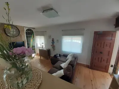 a living room with a couch and a table at Maresme´s corner in Sant Andreu de Llavaneres