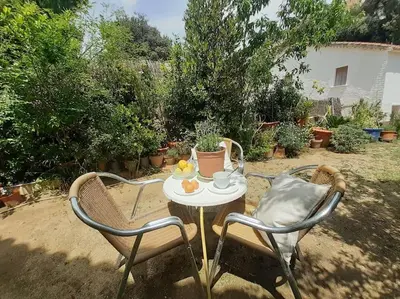 two chairs and a table with a cup on it at Maresme´s corner in Sant Andreu de Llavaneres