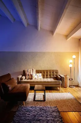 a living room with a couch and a table at Dormsy Pension Boutique in Arenys de Mar