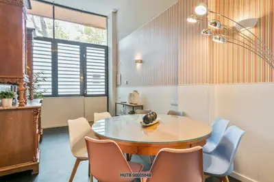 a dining room with a table and chairs at Alcam Les Corts in Barcelona