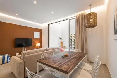 a living room with a table and a couch at Calella Apartments by Olala Homes in Calella