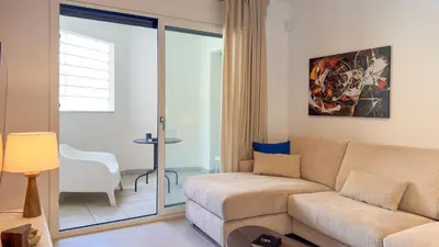 a living room with a couch and a table at Calella Apartments by Olala Homes in Calella