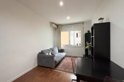 a living room with a couch and a table at Sagrada Familia Bliss in Barcelona