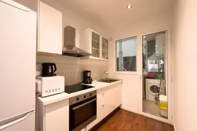 a small kitchen with a sink and a microwave at Sagrada Familia Bliss in Barcelona