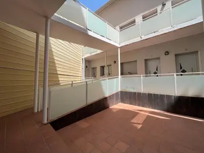 an empty balcony of a building with windows at Cozy apartment well-located in Terrassa, Barcelona in Terrassa