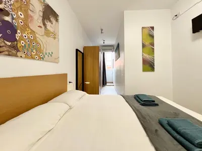 a bedroom with a bed in a room at Torre de Gracia Barcelona in Barcelona