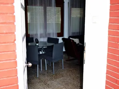 a dining room with a table and chairs at AFRODITA Casa con dos apartamentos independientes in Pineda de Mar