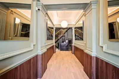 a hallway in a building with wood floors and a hallway with a hallwayngth at Sweett - Casa Miro in Barcelona