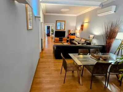 a living room with a couch and a table at Luxury Central Apartment in Barcelona